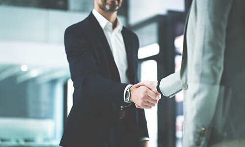 two business colleagues shaking hands