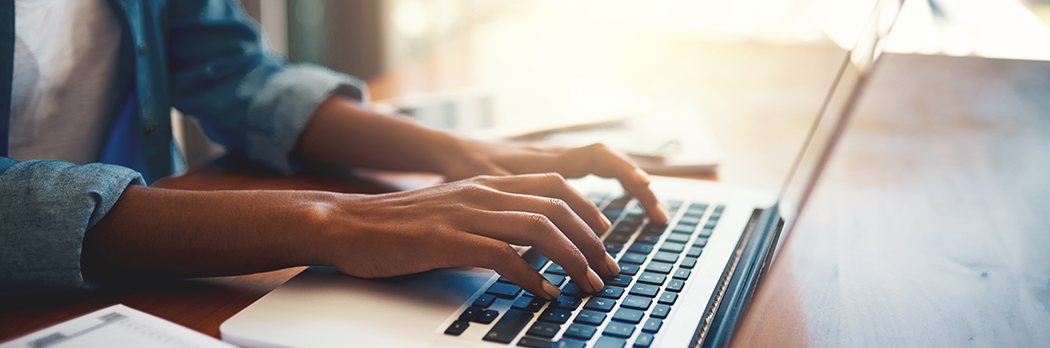 Person typing on laptop